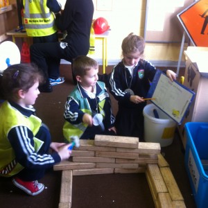 An architect showing the builders her plans!